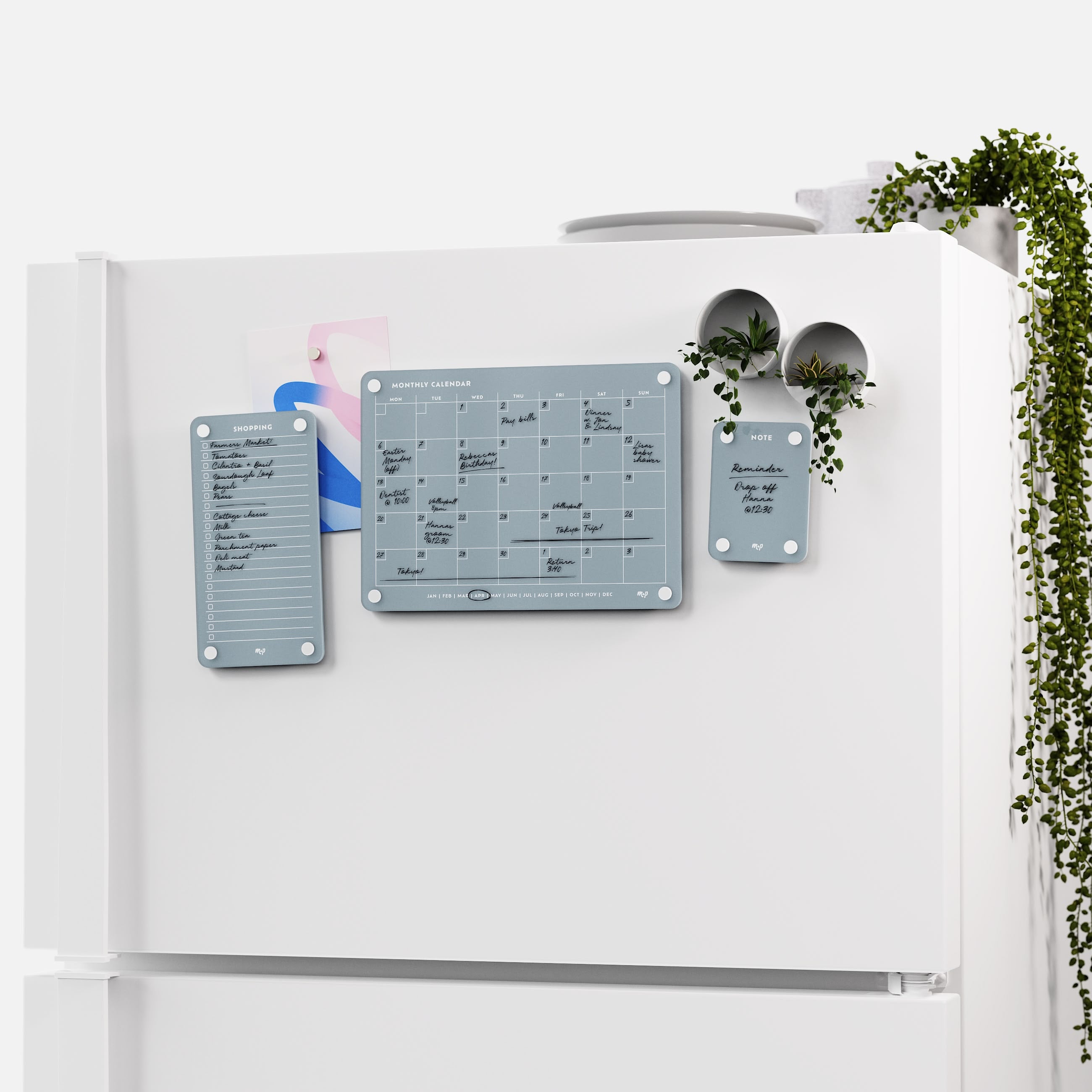 White fridge with the Slate grey shopping list, monthly calendar and note board and two magnetic planters